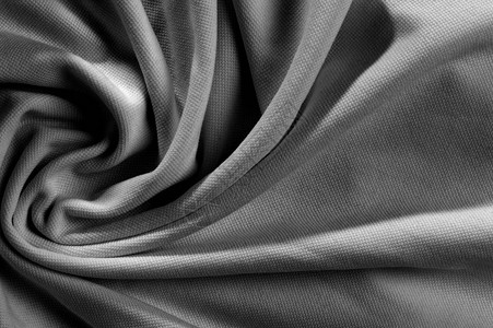 高清图片新起皱纺织面料深灰色高清图片深色木质背景上的缝纫配件牛仔