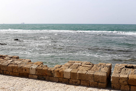 以色列老堡垒的石头和混凝土墙背景图片
