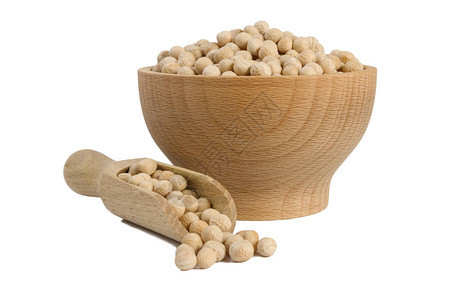 木碗中的黄豆和白底勺中分离的独奏营养生物图片