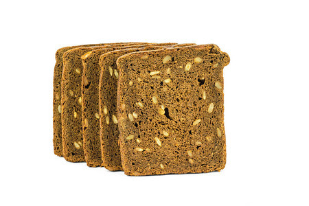 五块粗面包被白纸隔绝是谷类食品的产物图片