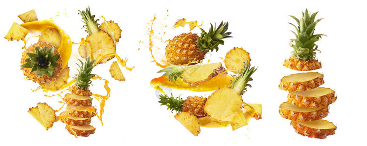 设置不同的飞行在空气中新鲜成熟的整体和切小菠萝与切片叶子和果汁飞溅隔离在白色背景图片