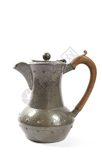 白色背景上的复古金属华丽茶壶图片