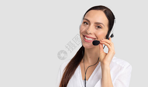 灰色背景耳机呼叫中心顾问手持耳机的求图片
