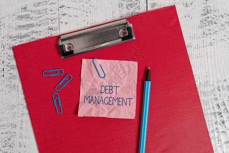 显示债务管理的书写笔记债务人和债权人之间正式协议的商业概念彩色剪贴板压碎便签夹图片