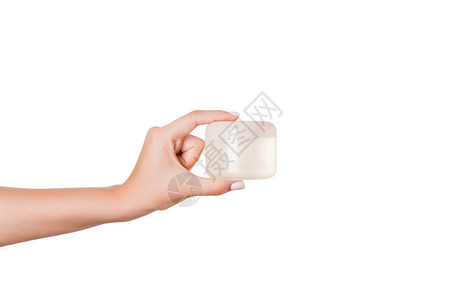女手握奶油液瓶图片