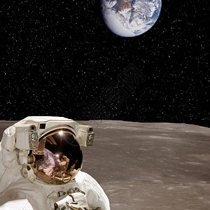 月球和地球星上的宇航员在幕后由美国航天局提供的这图片