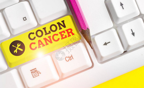 手写文本结肠癌结肠或直肠癌细胞发展的概念照片白色pc键盘图片