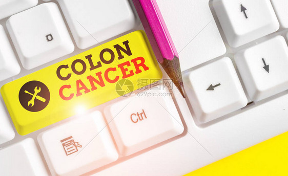 手写文本结肠癌结肠或直肠癌细胞发展的概念照片白色pc键盘图片
