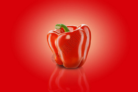 红色背景上的新鲜红色甜椒或保加利亚胡椒图片