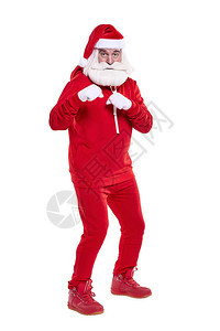 摆在红色运动装的圣诞老人的画象在白色隔绝了充分的成长图片