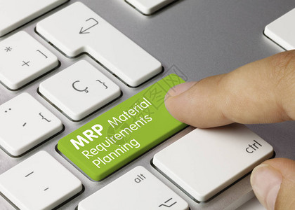 MRP物料需求计划绿色键盘上的铭文材料需求计划写在金属键盘的绿色键图片
