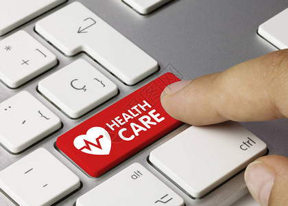 保健蓝色键盘上的铭文医疗保健写在金属键盘的蓝键图片