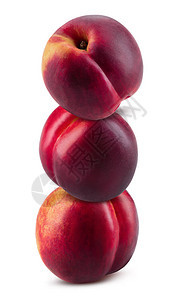 三个皮肤光滑甜美的油桃隔离在白色背景上图片