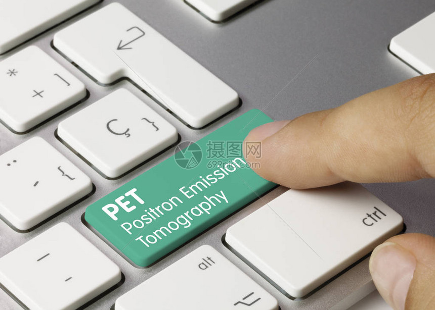 PET正电子发射断层扫描写在金属键盘的绿色键图片