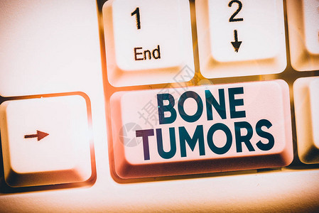 手写文本骨肿瘤概念照片可以是在白色pc键盘中发现的良或恶生长图片