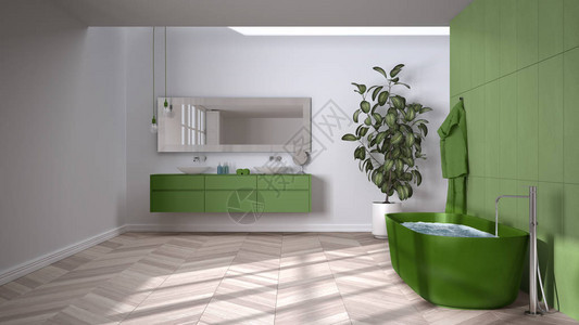 宽敞的绿色调浴室配有人字形镶木地板特写独立浴缸带毛巾和瓶子的双水槽镜子盆栽植物简背景图片