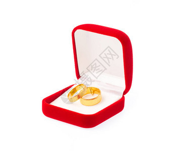 红色天鹅绒盒上的金环在白图片