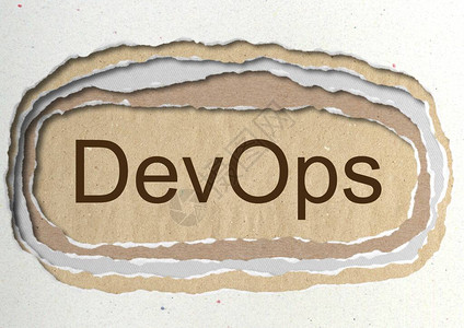 DevOps破烂纸洞背景中的词软件开发和信息技术操作图片