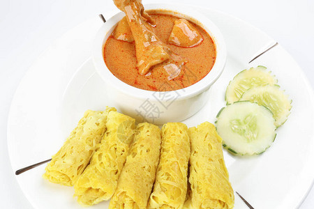 传统马来小吃食品RotiJala用咖喱鸡喂罗蒂贾拉图片