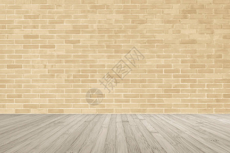 浅黄色棕色砖墙木地板上图片