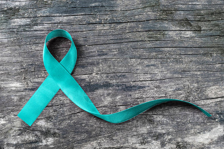 对卵巢癌多囊卵巢综合征PCOS疾病创伤后应激障碍PTSD强迫症OCD的蓝绿色丝带意识图片