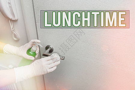 手写文本午餐时间中午或中午吃食物时的概念照片电子产品表面受消毒图片