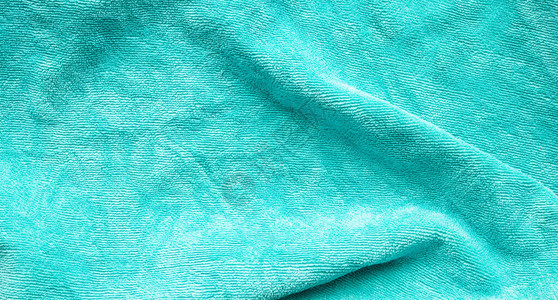 绿色毛巾织物纹理表面特写背景图片