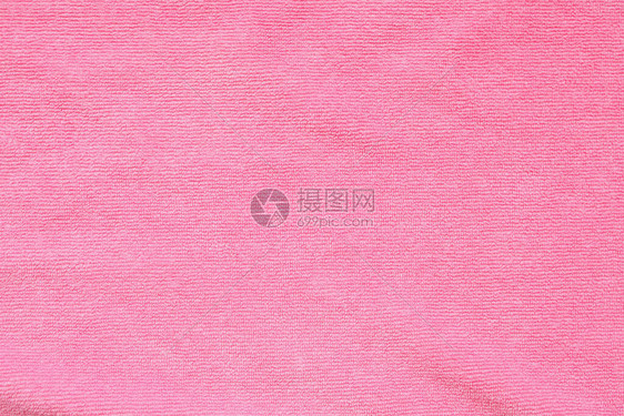 粉红色毛巾织物纹理表面特写背景图片