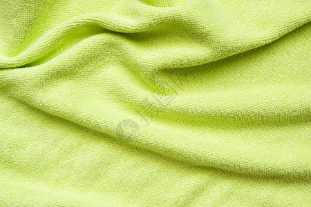 绿色毛巾织物纹理表面特写背景图片