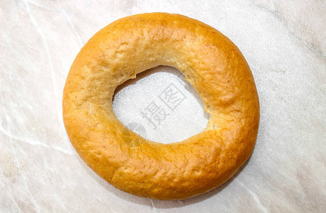 圆形的富豪的光背景的面包圈最顶端图片