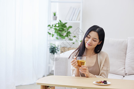 惬意生活秋冬居家女性喝下午茶背景