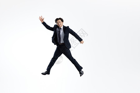 跳跃漂浮的商务男士形象背景图片