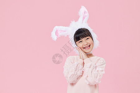 粉色兔女生头戴兔耳朵的小女孩背景
