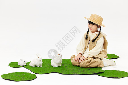 可爱小女孩与小兔子玩耍图片