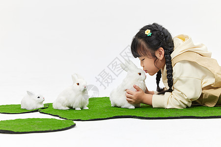 孩子扮演小兔子可爱女孩与小兔子互动背景