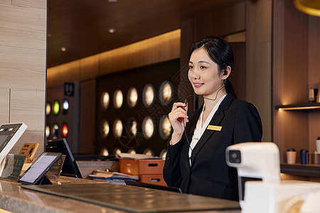快捷酒店前台女服务员图片素材