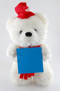 泰迪熊带着空白的床单在白色背景上用自图片