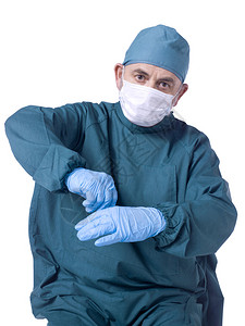 一名外科医生身着不育的蓝色长袍图片