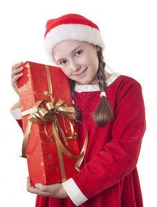 身着圣诞服装和红色圣塔帽子的漂亮女孩图片