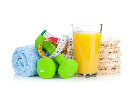 两种绿色哑铃磁带和健康食品身体健康与健康白图片