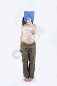 8个月8个月的孕妇绿裤子赤腹站立图片