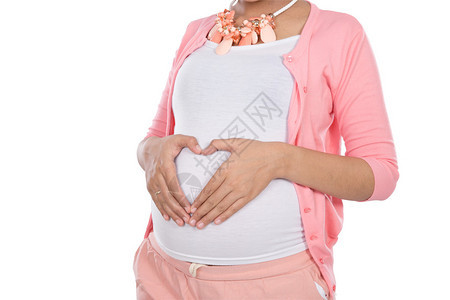 贴近一个孕妇的肚子和手抚摸着爱图片