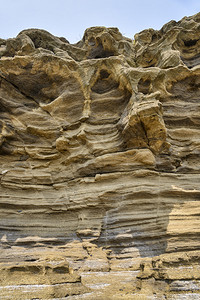 济州岛的龙尾海滩以壮丽的海边风光和由砂岩堆砌而成的海岸悬崖而闻名图片