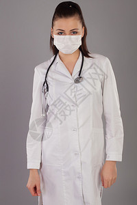 纱布护士的听诊器在灰色背景之下图片