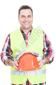 穿着防护背心手持头盔和手套的快乐男构造者在白色图片