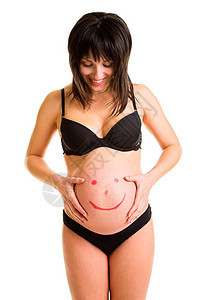 怀着微笑的表情绘画的孕妇腹部被图片