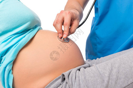 医生用听诊器听孕妇的肚子图片