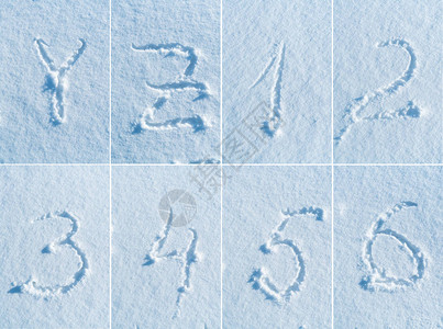 雪地里的英文手写字母表背景图片