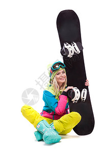 白色迷人的年轻白人女孩身着五颜六色的滑雪服蓝色雪地靴和黄色长裤背景图片