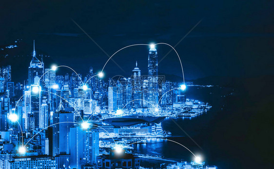 香港市区及维多利亚港的数码网络连接线智慧城市金融区技术理念摩天大楼和高层建筑夜间鸟瞰图图片